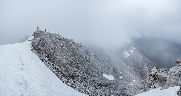 Leaving the top in swirling clouds and light snow.