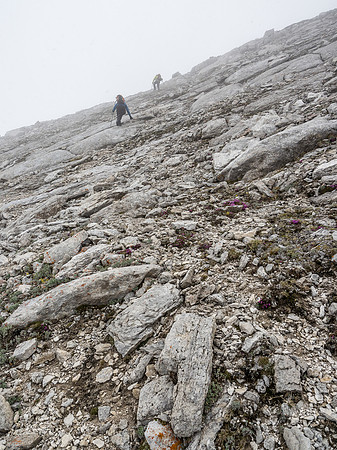 Grinding up to the summit in a greyout.