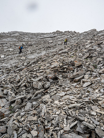 Grinding up to the summit in a greyout.