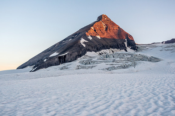 Sunrise on our mountain, rising like a black beauty out of the snow and ice.