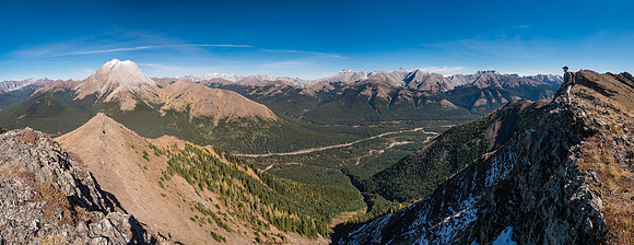 In between the two high summits along the ridge.