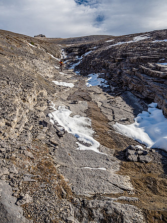 The running water finally decides to turn to ice as we work our way up in a shallow gully.