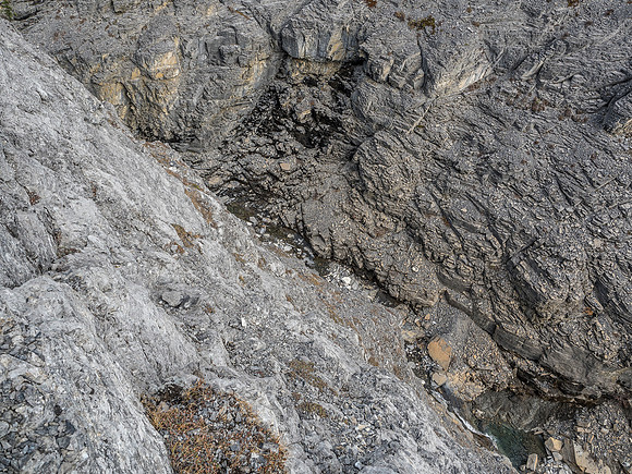 Looking straight down into Claw Creek from the crux wall we ascended.