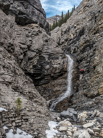 Trevor searches for a way around the crux waterfall.