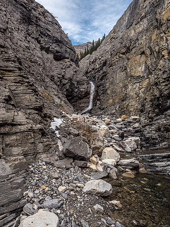 Trevor searches for a way around the crux waterfall.