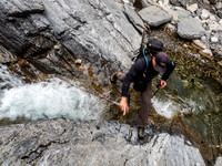Cornelius jumps over a narrow section of Claw Creek.