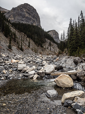 Soaring rock buttresses coming off Poltergeist Peak to the left as we start up a narrowing Malamute Valley.
