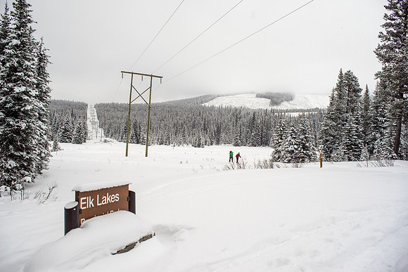 Looking back at the hydro line / trail as we finally arrive at the Elk Lakes summer parking lot.
