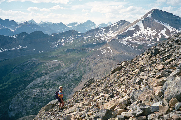 Sonny labors up the loose slopes of Dolomite with a view of Cirque Peak opening up in the background.