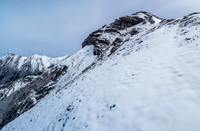 Looking up to the col and ascent slope to the summit ridge.