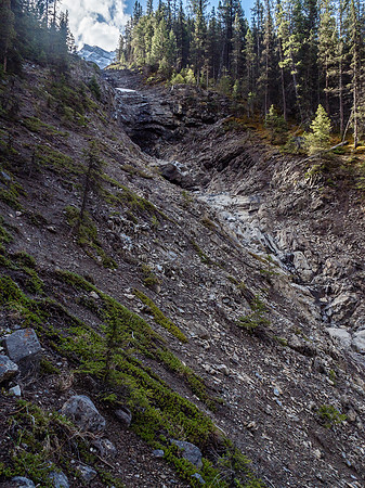 Ascending the steep lower section of the drainage on climber's left.