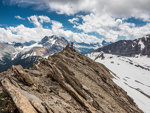 Phil at the giant summit cairn on Cross Ridge.