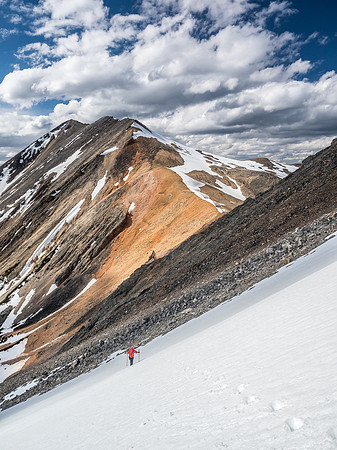 Mike on the snow slope with Landslide in the distance.