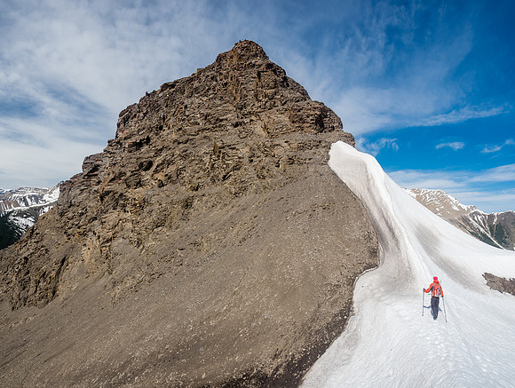 Mike traverses from the col between the two summits towards the summit of Ernest Ross.