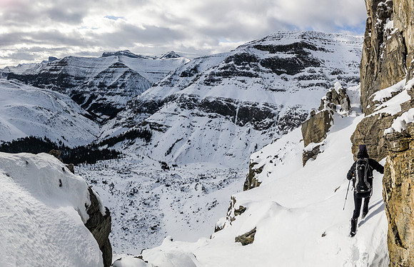 Phil leads the way across the ledge. Note the ice climb at left?