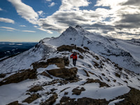 It's a strangely windless day as Raf follows me up the south ridge.