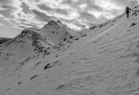 Phil kicks steps to the south ridge of Kink with Fallen looking attractive to the left.