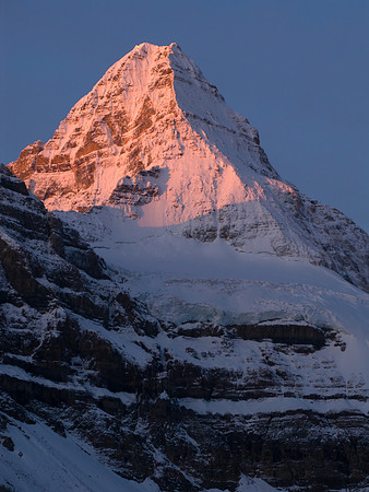The night reluctantly gives up to the sun on Mount Assiniboine.