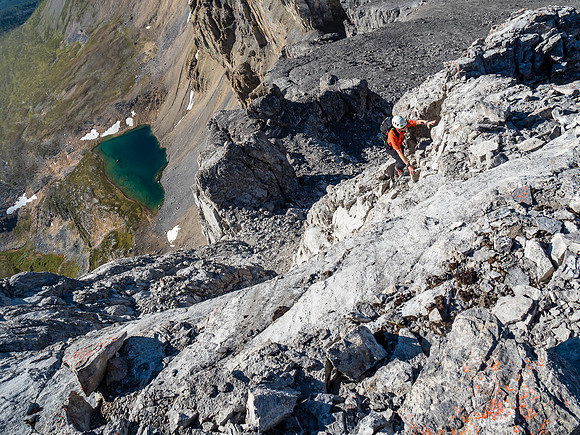 Phil climbs the crux on good holds and solid(ish) rock.