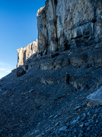 Traversing the headwall to an obvious weakness on climber's left.