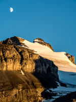 The moon rises over Mount Hector.
