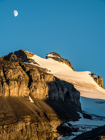 The moon rises over Mount Hector.
