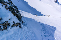 Looking back down at Ferenc after ditching the 'shoes and rocketing straight up the steep snow slope.