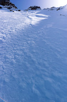Looking up at the rock bands above our route. We easily broke through them on good snow.