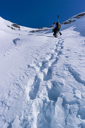 Ferenc continues to break trail for a while as we get higher up the west face beneath the AA col.
