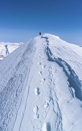 Ferenc stands on the summit of Mount Athabasca.