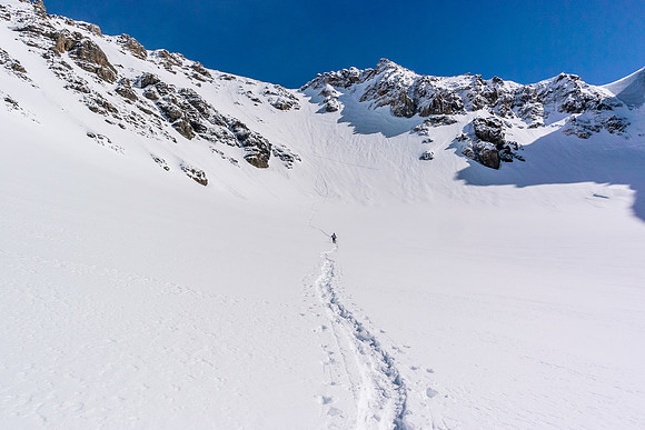 Getting away from the steep slopes, looking back at Ferenc exiting the face to the AA col.