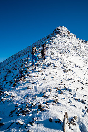 Grinding our way up to the summit block on slick rocks.