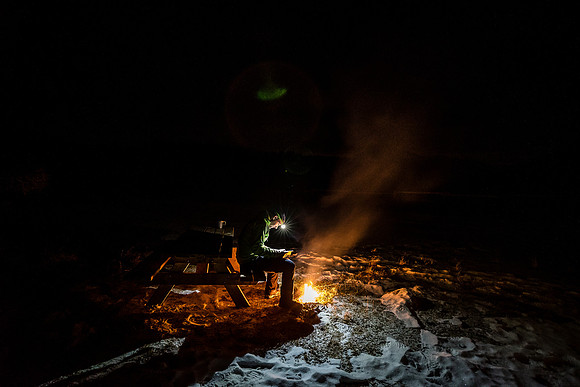 Vern enjoys a relaxing evening fire in the free Big Horn Campground near Ya Ha Tinda.