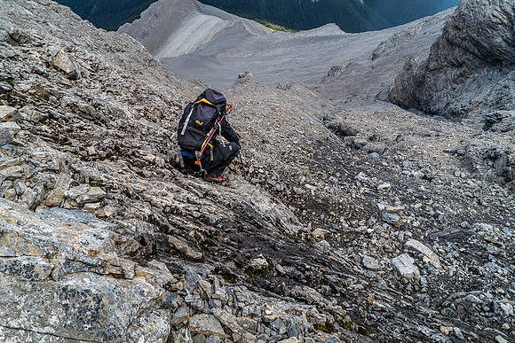Delicate down climbing on wet slabs.
