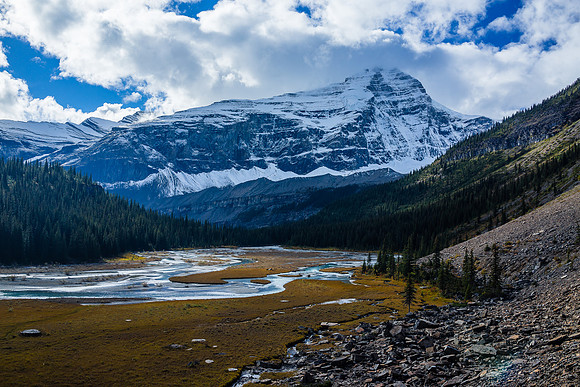 Looking back over the Robson River bog (trail on right over scree) - Whitehorn rising into clouds beyond.