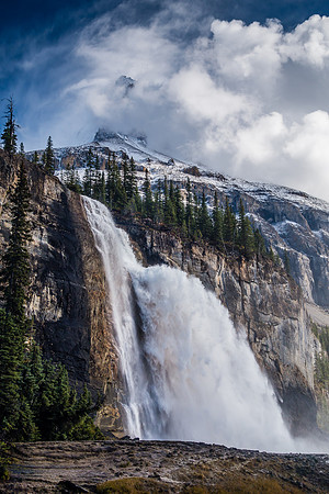An amazing scene of power and beauty. Emperor Falls with the lower part of Robson's Emperor Ridge towering in the swirling clouds above.