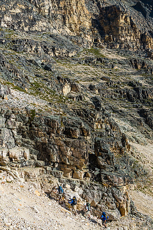 The other 4 guys head up the right side of the left branch of the gully.