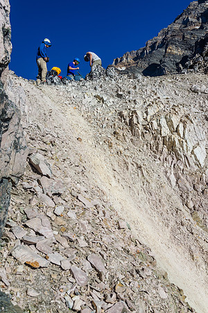 The guys prepare to lower the rope to Ben (out of sight on lower right of photo).