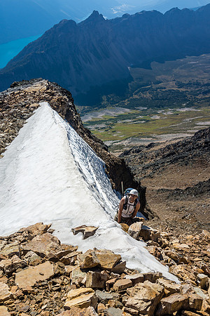 A steep snow slope in the gully, near the top out before the difficult scrambling