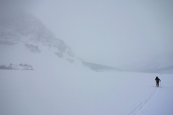 Skiing across Bow Lake in a white-out