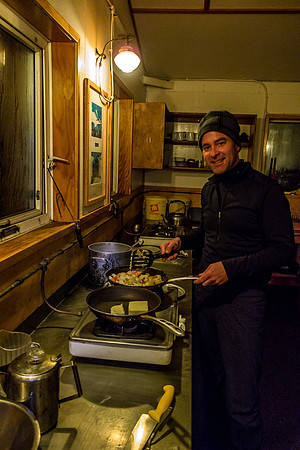 Kelly fries up the potatoes and carrots.