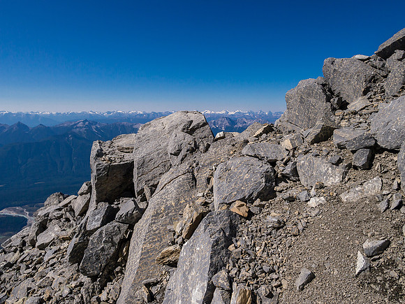 Looking at the loose terrain as I approach the crux.
