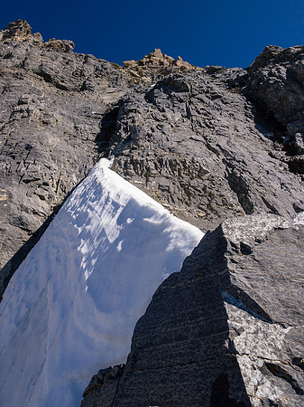 The snow arete just under the crux wall to the ridge. I used crampons to cross it and was glad I had them along.