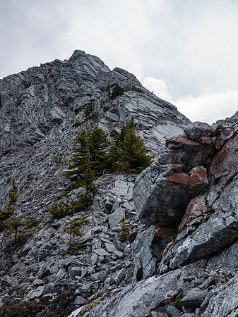 Looking up at the main crux as I make my way up the ridge between the difficult sections.