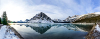 A wide panorama from about half way down the lake with my approach trail on the left, Crowfoot at center and the trail forwards at right.