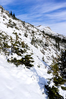 I side-hilled up this slope until I spotted a ledge traverse to the main bowl under the slopes to the summit.