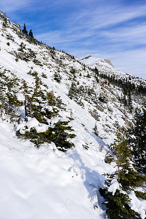 I side-hilled up this slope until I spotted a ledge traverse to the main bowl under the slopes to the summit.