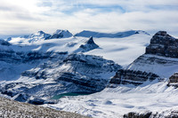 Incredible lighting and views over an unfrozen Iceberg Lake (feeds Bow Falls) towards Portal, Gordon, St. Nicholas, Olive and Balfour