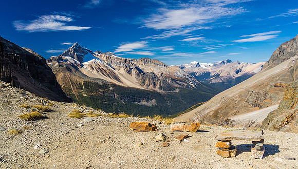 View from the col, looking down the approach valley with Cathedral at left and the Sherbrooke Lake area in the far distance.