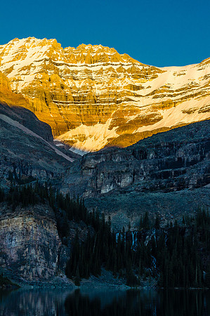 Incredible late day lighting on Lefroy with Seven Vail Falls tumbling into Lake O'Hara at bottom.